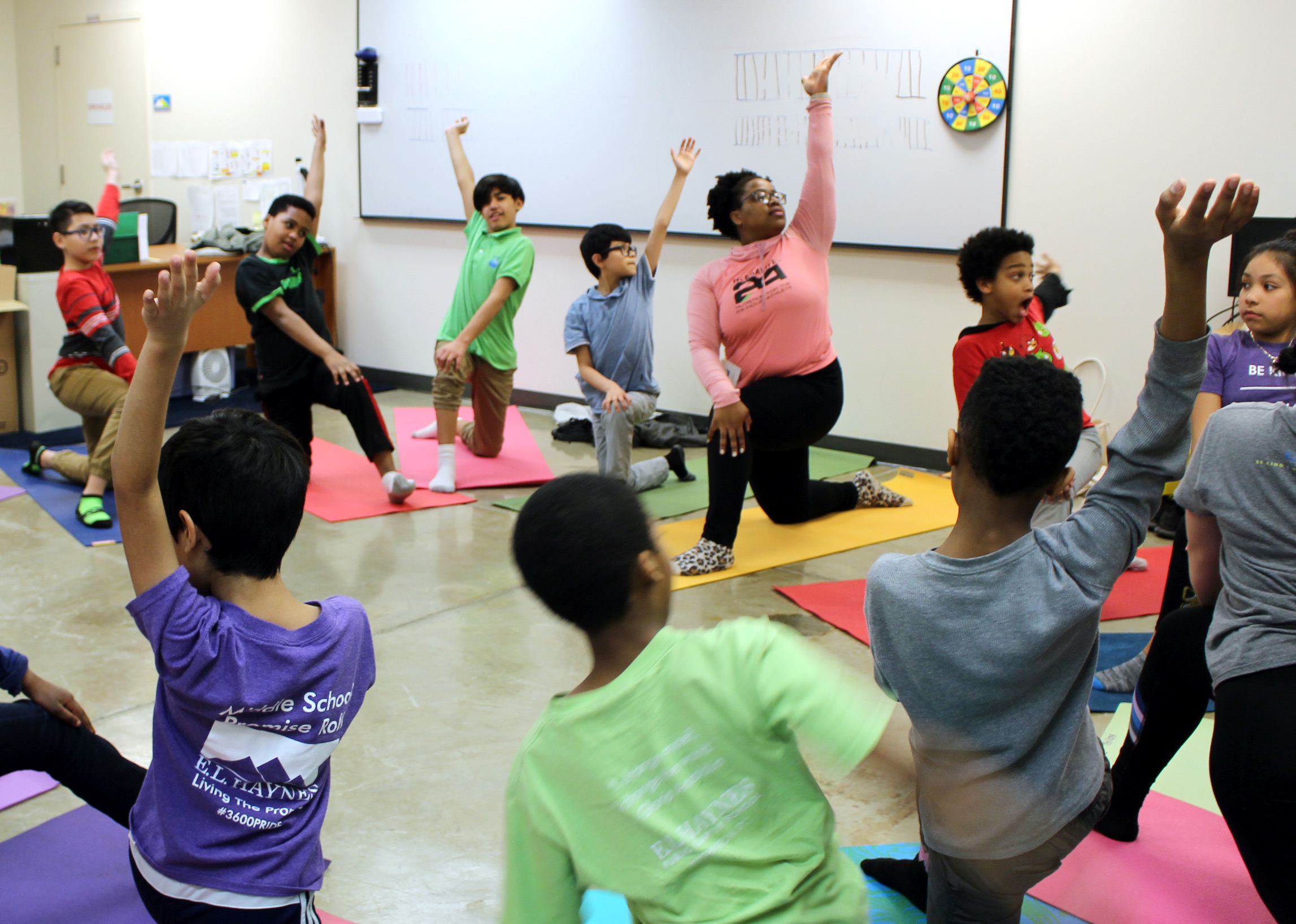 Middle school students learn new yoga poses and practice mindfulness during our annual campus-wide Wellness Day.